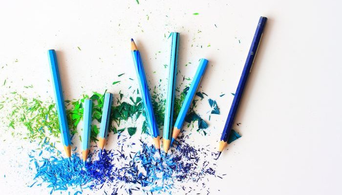 Range of blue coloured pencils with sharpenings
